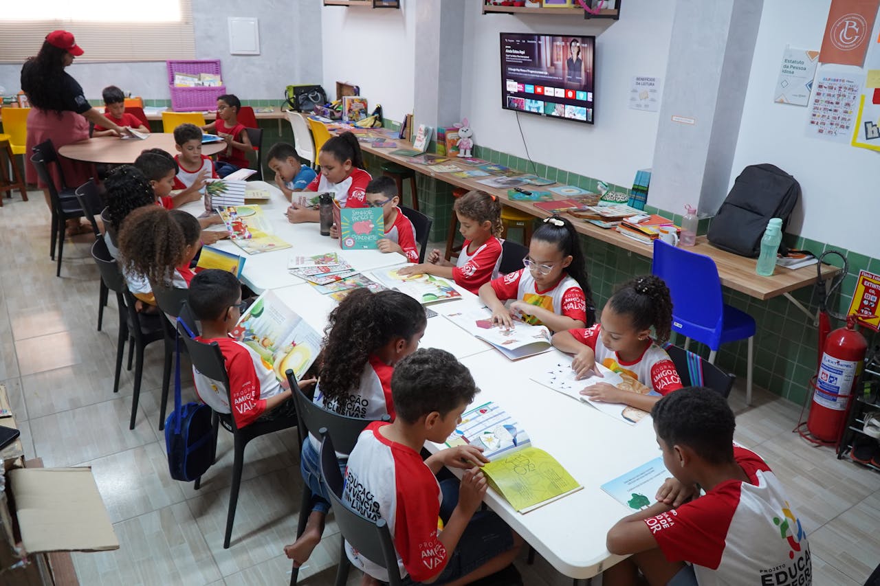 services-03 Children engaged in reading at a community library in Glória do Goitá, Brazil.