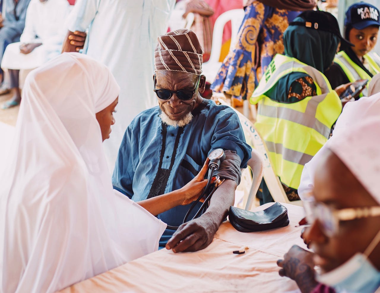 services-01 Elderly man receives medical care during community health outreach in Kaduna, Nigeria.