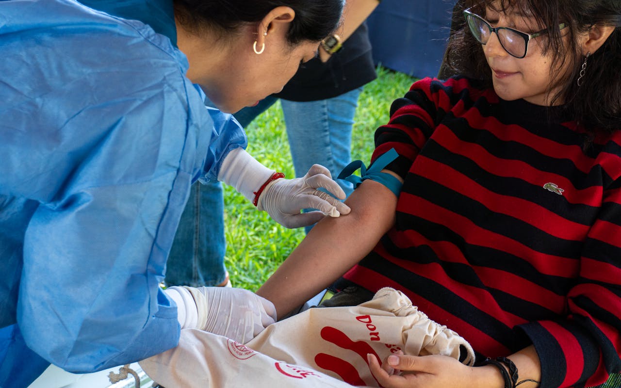 services-02 A donor giving blood at an outdoor donation event in Piura, Peru.